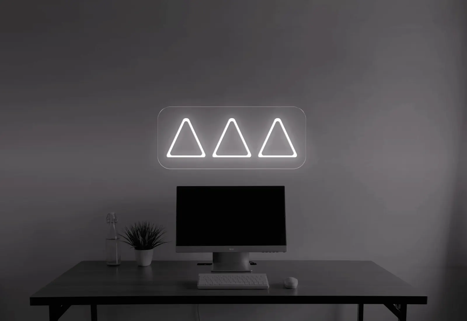 A minimalist single-line neon sign with simple lettering and one colour