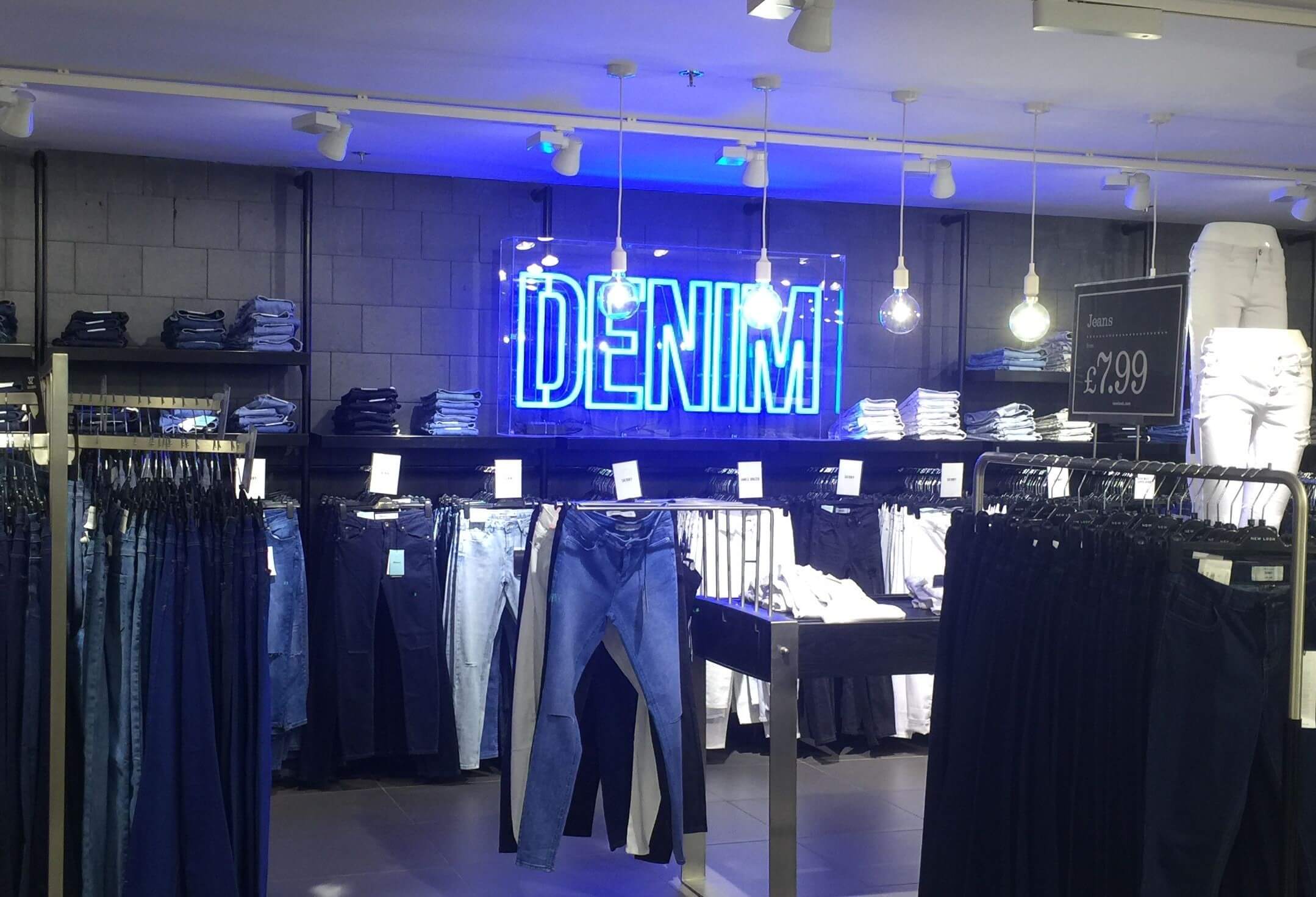 Electric blue neon signs at retail stores Electric blue neon signs at retail stores